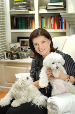 Lora Hemphill sitting with her dogs.